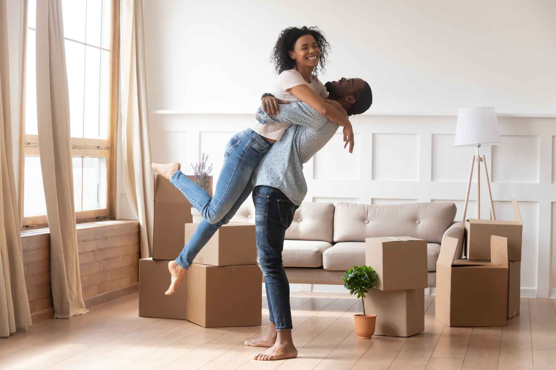 Married couple moving in new property bought together on mortgage loan helped by furniture removals in Cape Town.